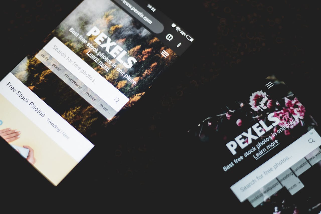 Crafting Captivating Headlines: Your awesome post title goes here Close-up of smartphones displaying Pexels stock photo website, showcasing modern technology.